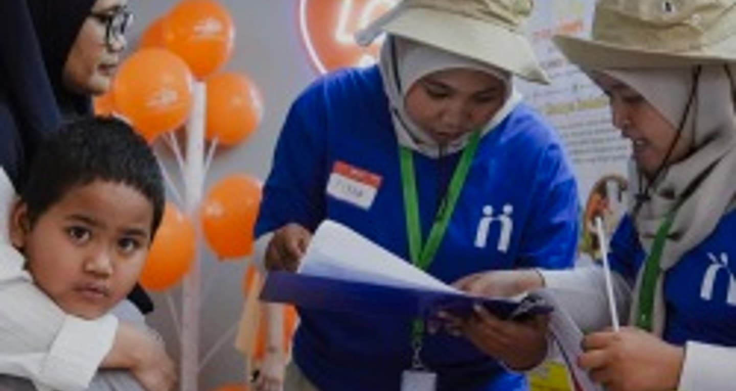 Community volunteers and educators working with neurodivergent children