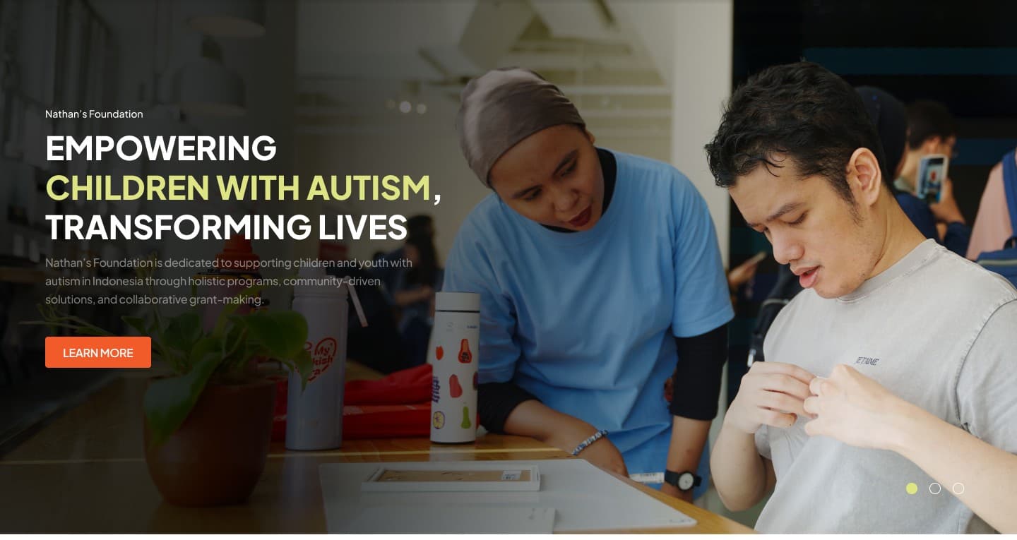 Young man with autism learning vocational skills alongside supportive caregiver
